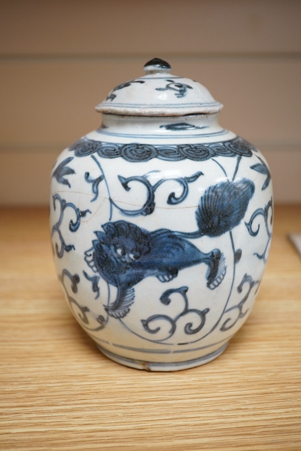 A Chinese blue and white Lion-dog jar and cover, late Ming dynasty, 17cm. Condition - poor